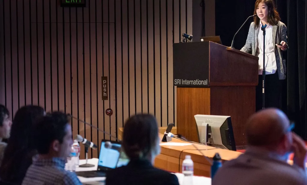 SRI-Internal-rD-program-presentation-at-podium