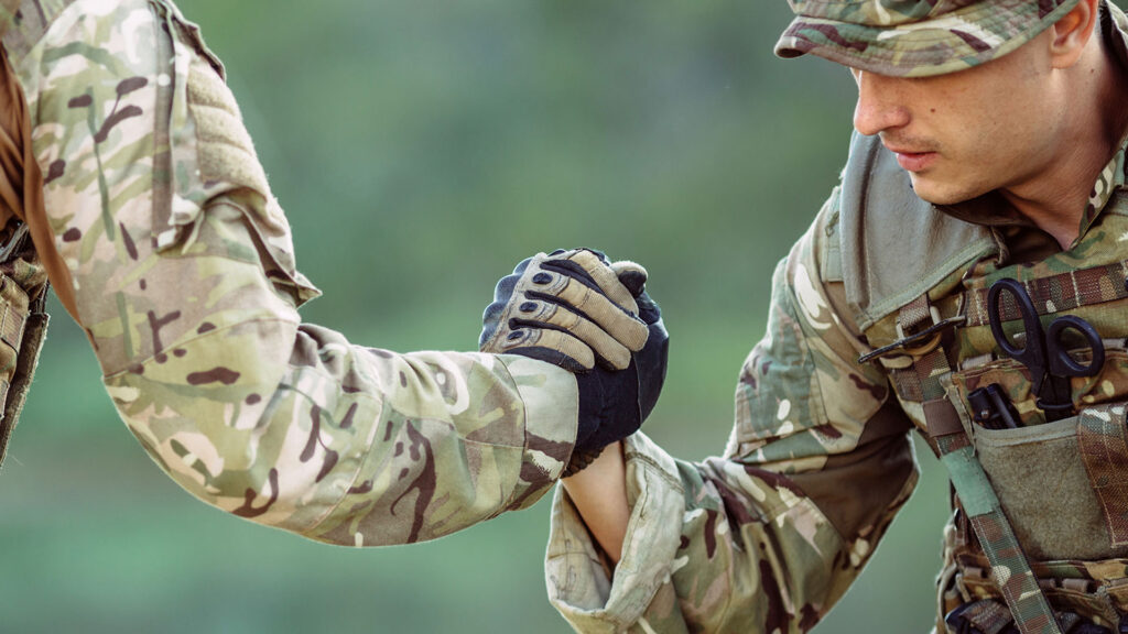 Soldiers clasping hands